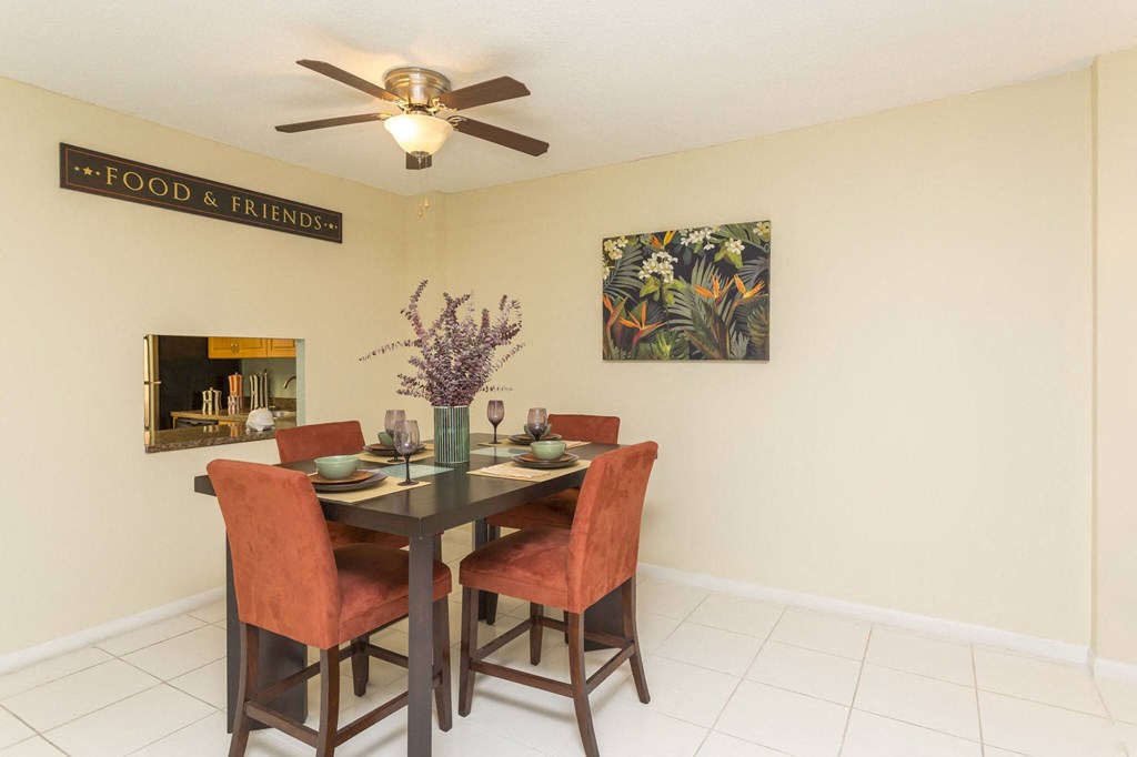 a dining room with a table and chairs