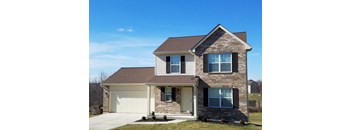 A two-story house with a garage on the ground floor.