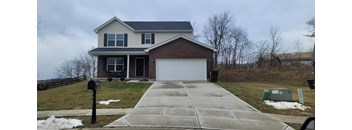 a house with a white garage door in front of it