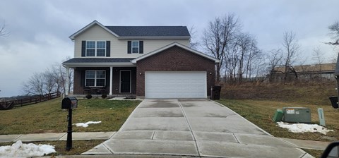 a house with a white garage door in front of it