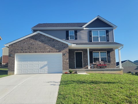 a house with a white garage door in front of it