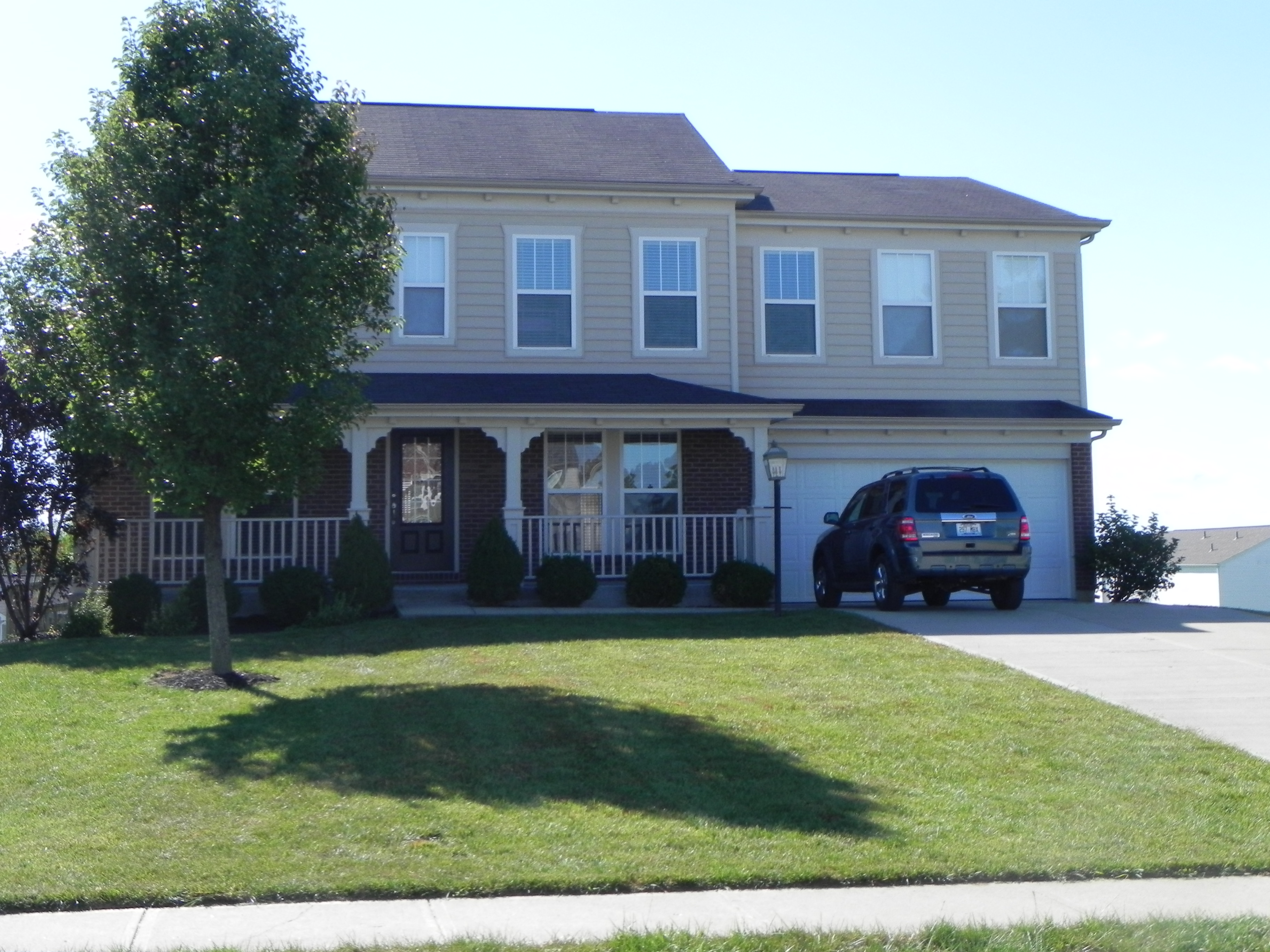 a house with a car parked in front of it