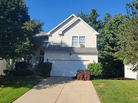 a white house with a white garage door