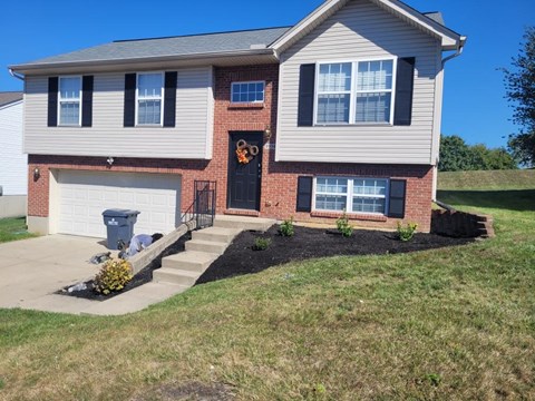a house with a front yard that has been landscaped