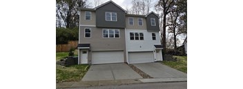 A two-story house with a garage.