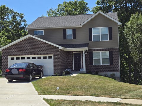 a house with a car parked in front of it