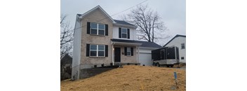 a house with a truck parked in front of it