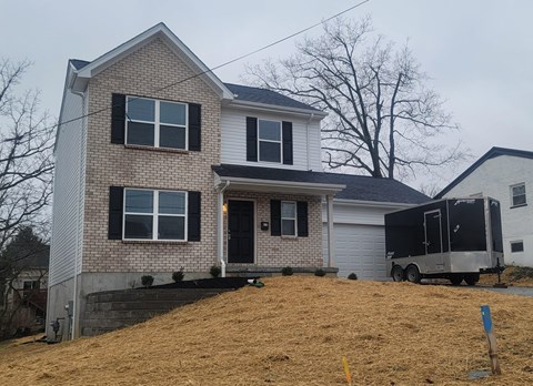 a house with a truck parked in front of it