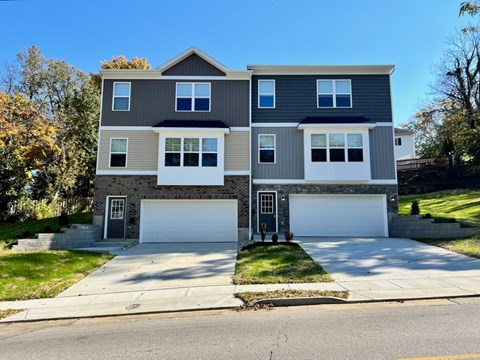 A two-story house with a grey and white exterior.
