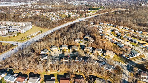 A residential area with houses and trees.