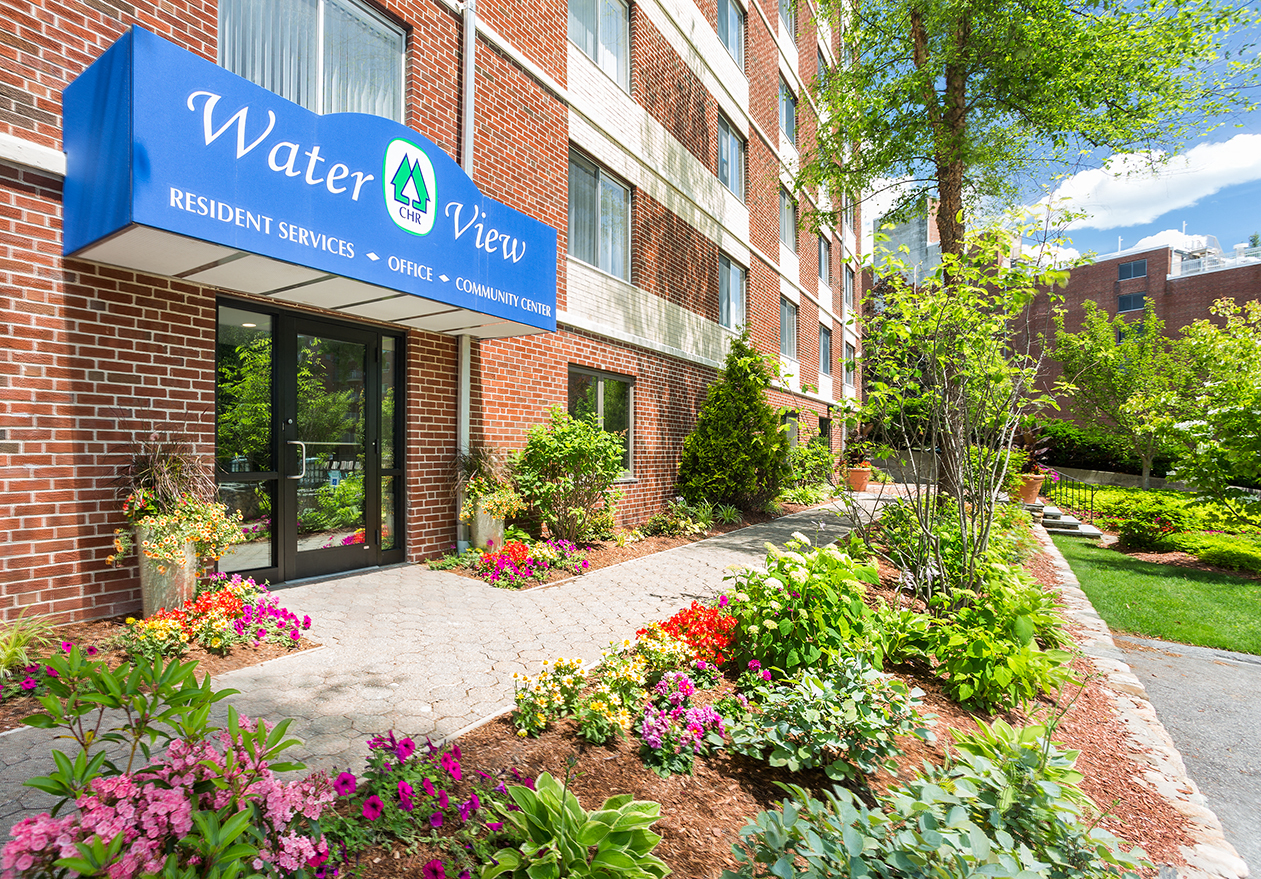 A building with a blue sign that says Water View.