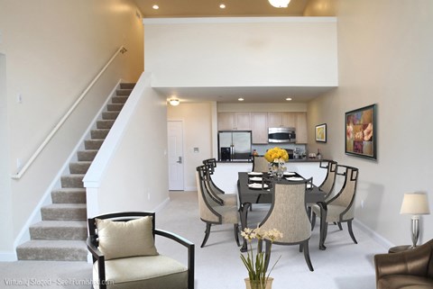 A dining room with a table set for six.