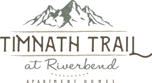 A logo for Timmath Trail at Riverbend Apartments.