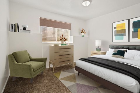 A bedroom with a bed, chair, and dresser.