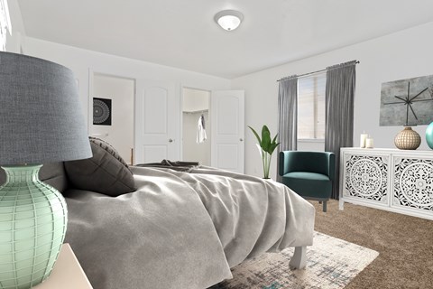 A well-lit bedroom with a large bed and a green lamp.