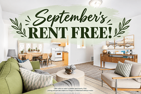 A living room with a couch, coffee table, and a sign that says "September's RENT FREE!".
