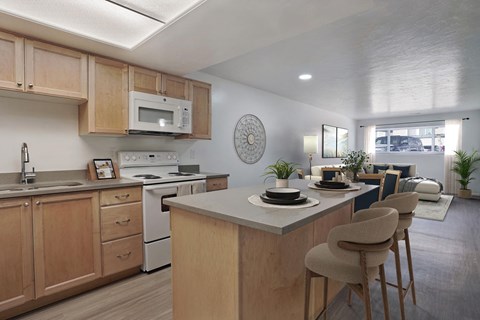 A kitchen with wooden cabinets and a white countertop.