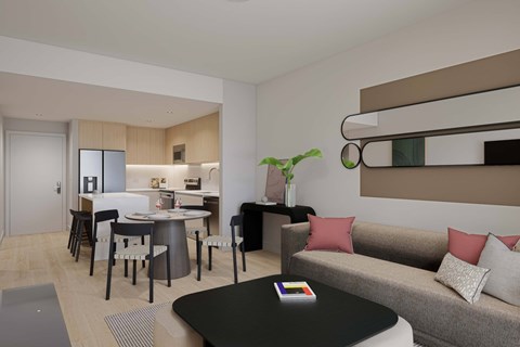 A modern living room with a grey sofa and a black coffee table.