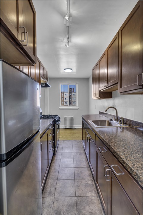 a kitchen with stainless steel appliances and granite counter tops
