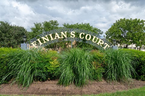 a sign that reads flints court in a garden