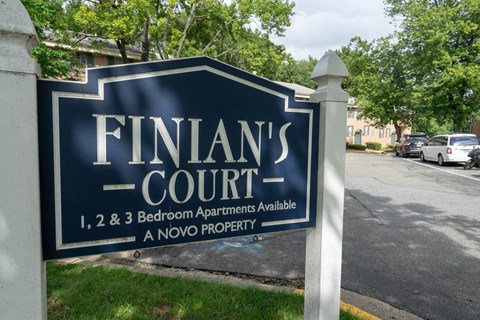 a sign for finlands court in front of a street