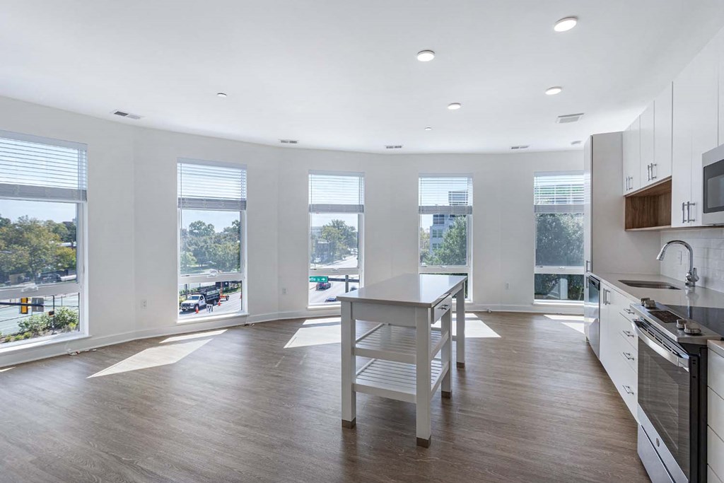 A modern kitchen with a large island in the middle.