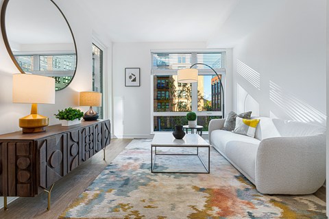 a living room with a white couch and a coffee table