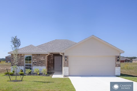 A house with a Camden Homes logo in the corner.