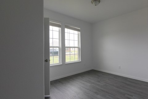 A room with a door and a window.