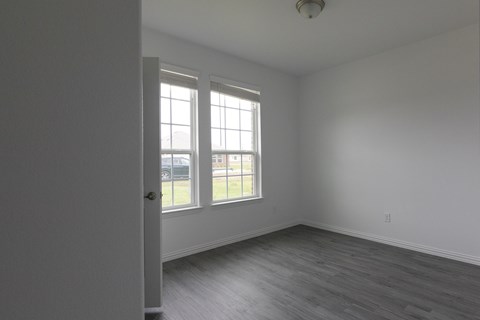 A room with a door and a window.