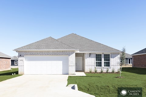 A house with a Camden Homes logo in the corner.