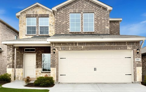 A two-story house with a garage door that has the number 11 on it.