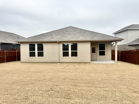 A house with a brown fence and a brown roof.