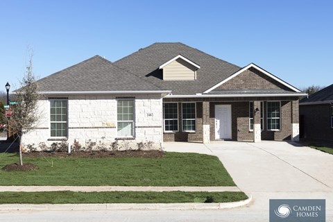 A house with a Camden Homes logo in the corner.