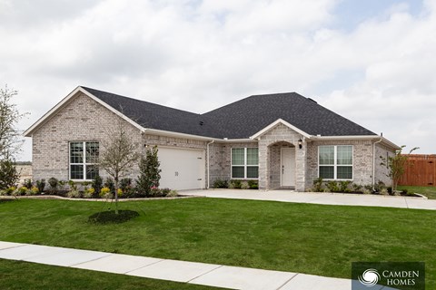 A house with a Camden Homes logo in the corner.