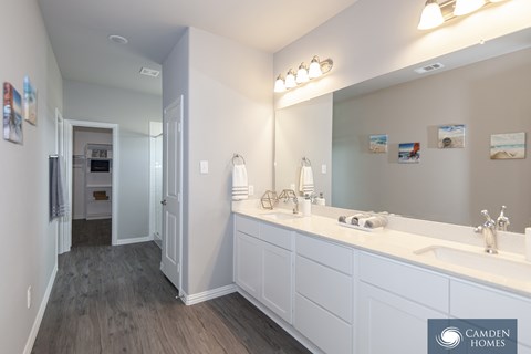 A bathroom with a Camden Homes logo.