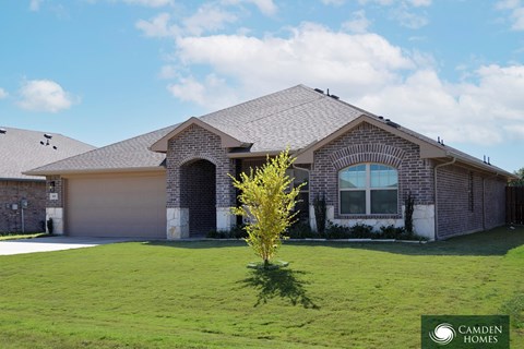 A house with a Camden Homes logo in the foreground.