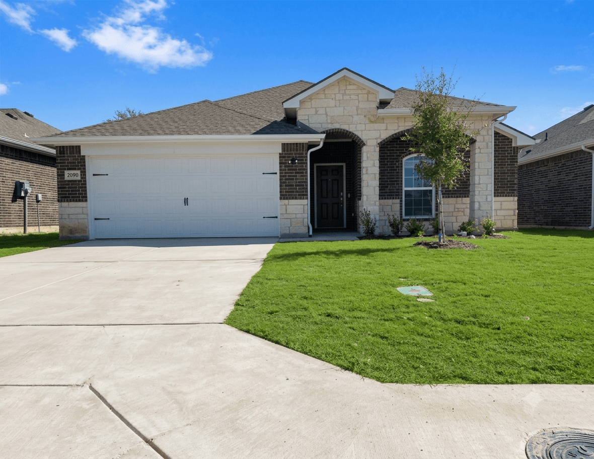 A house with a garage and a driveway.
