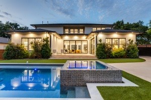 A modern house with a swimming pool in the backyard.