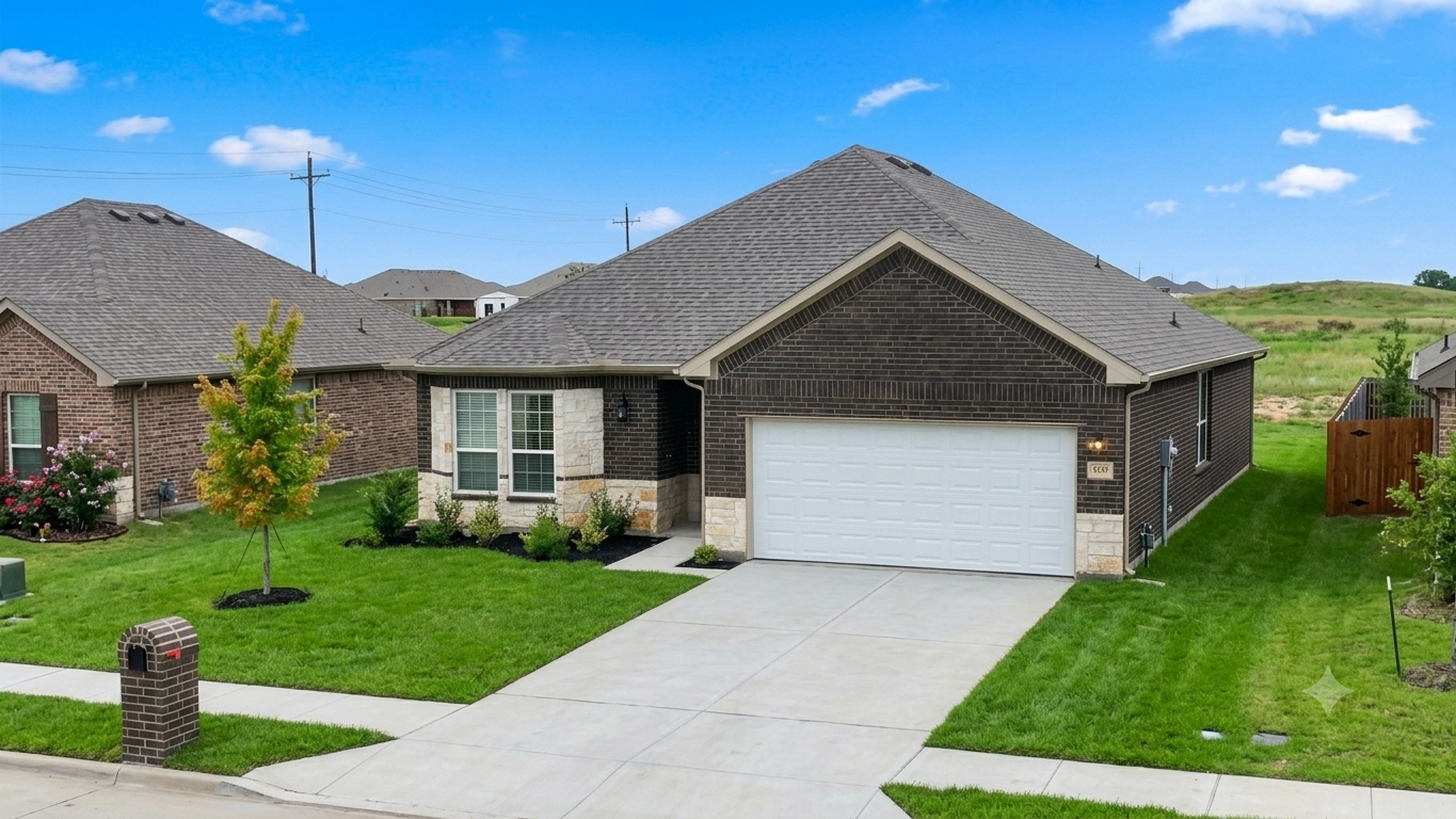 A house with a grey roof and a white garage door.