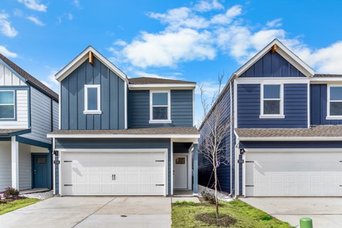 Two houses with garages are shown in the image.