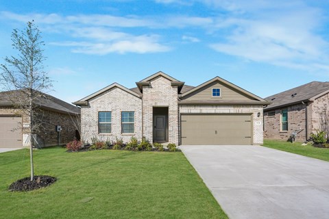 A large house with a garage and a driveway.