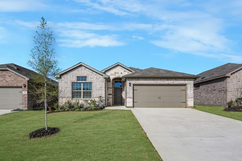 A house with a garage and a driveway.