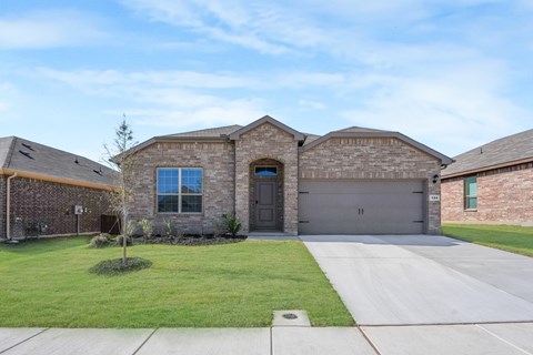 A house with a garage and a driveway.