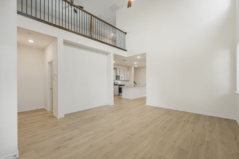 A room with wooden floors and white walls.