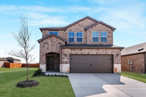 A house with a garage and a driveway.