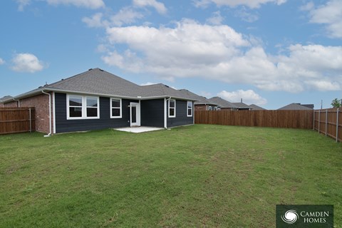A house with a Camden Homes sign in the front yard.