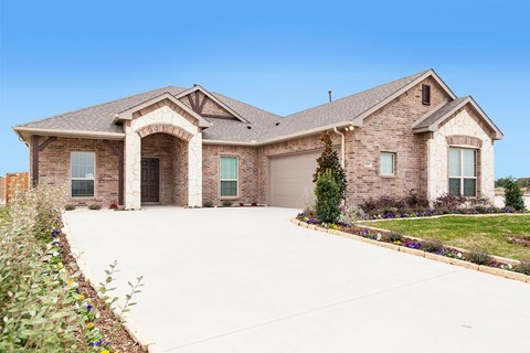 A large house with a driveway and a garage.
