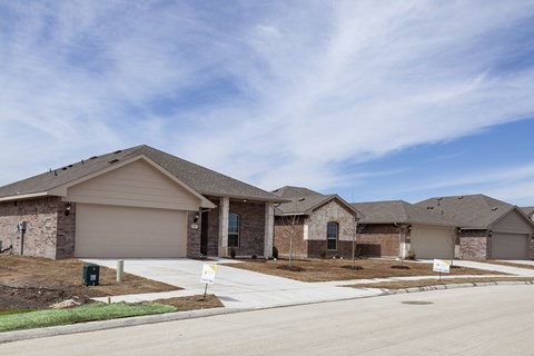 A row of houses with a clear sky above them.