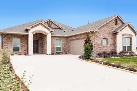A large house with a driveway and a garage.